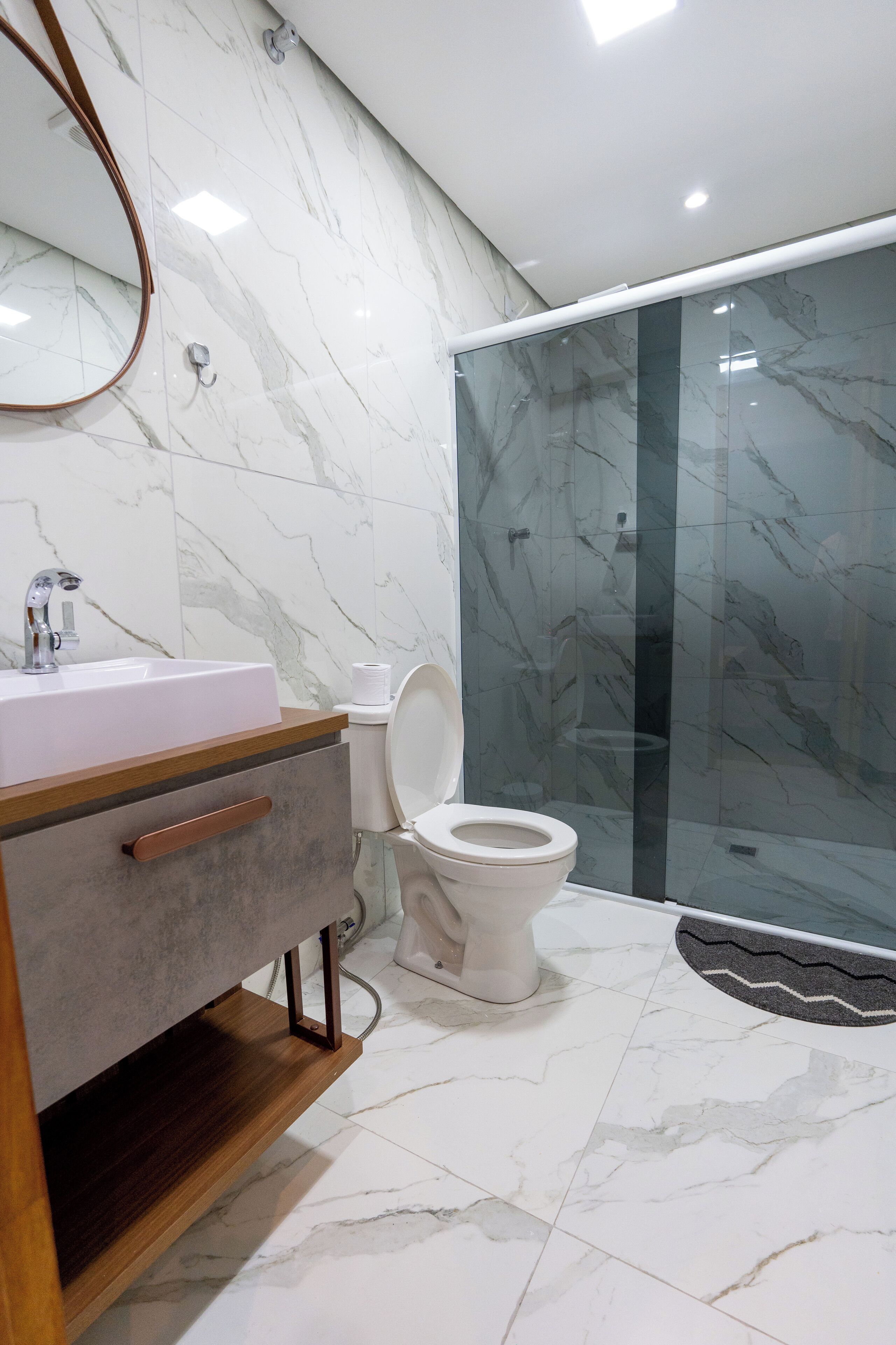 Basic Room, Multiple Beds, Private Bathroom | Bathroom | Shower, towels, toilet paper