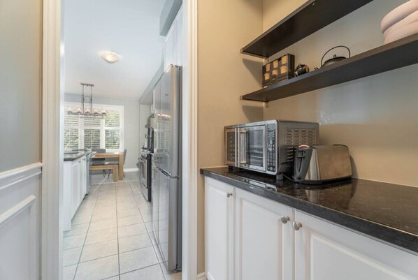 Fridge, microwave, stovetop, coffee/tea maker