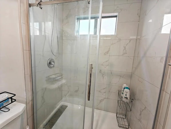 Shower, hair dryer, towels, soap