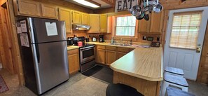 Fridge, microwave, oven, stovetop - Camp Valentine- charming 3 bedroom cabin with hot tub and fireplace in private setting (Swanton)