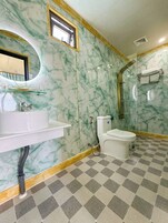 Deluxe Double Room, Beach View | Bathroom | Shower, free toiletries, hair dryer, slippers