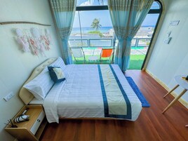 Deluxe Double Room, Beach View | Blackout drapes, iron/ironing board