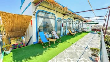 Deluxe Double Room, Beach View | Terrace/patio