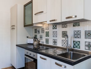 Fridge, oven, cookware/dishes/utensils