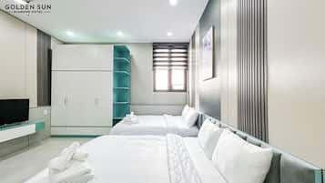 Suite familiar, 2 camas de matrimonio, baño privado, vistas al jardín | Decoración individual, mobiliario individual, escritorio