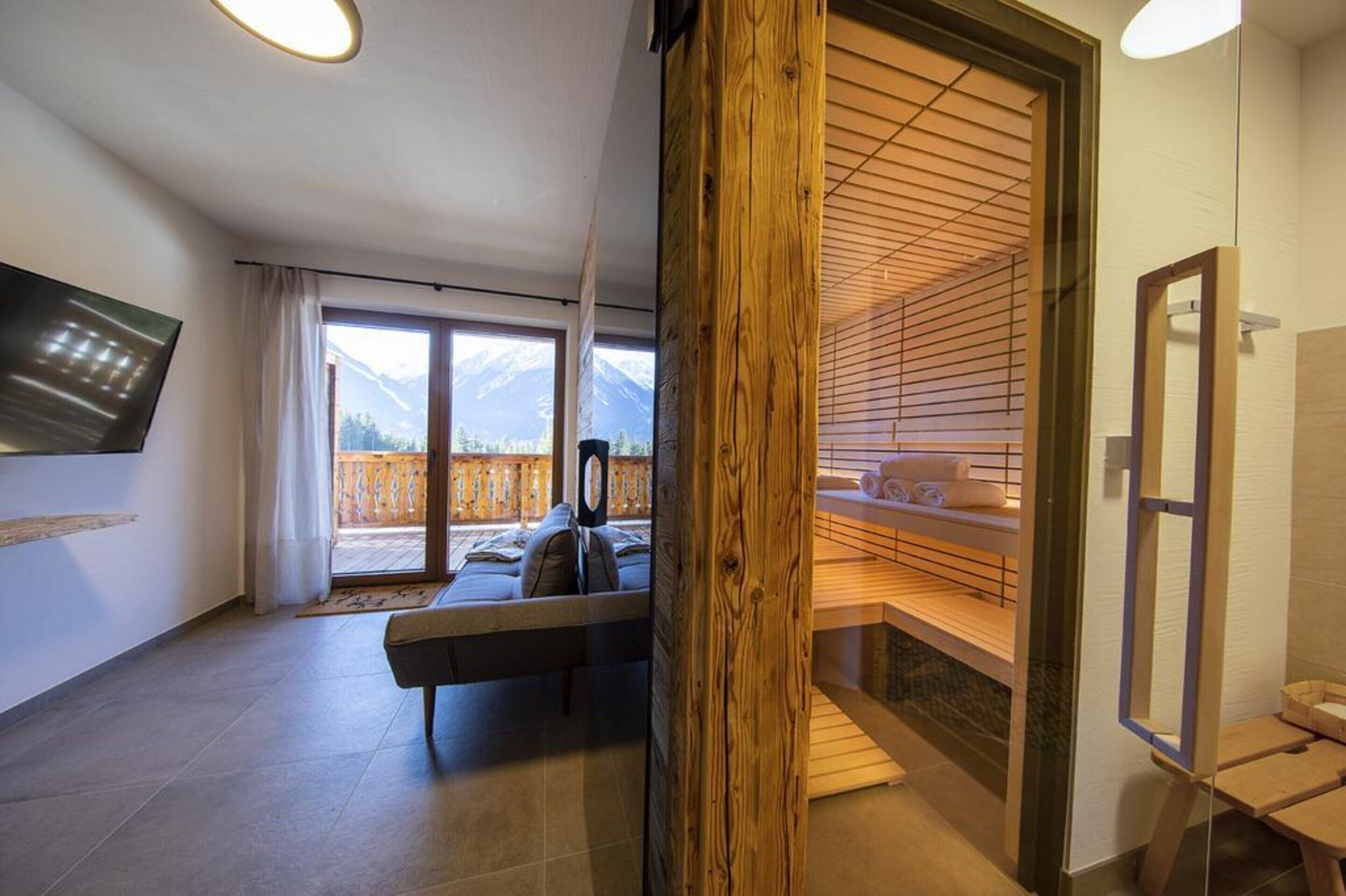 A modern room with a large window, a wooden bench, and a wooden shelf.