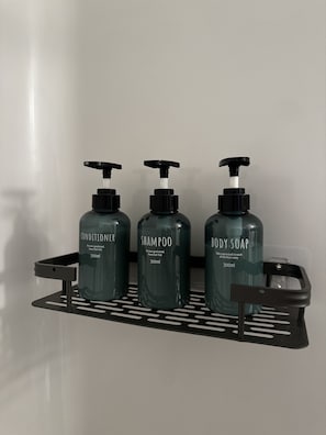 Shower, hair dryer, towels, toilet paper