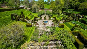 A formal garden with a central fountain, symmetrical pathways, and manicured hedges. - Spacious Country Farmhouse in Rewilding Landscape (Mapperton)