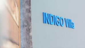 The name "INDIGO Villa" on a light-colored wall. - INDIGO VILLA Samui - superb sea view! (จ.สุราษฎร์ธานี)