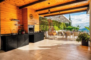 Enjoy a warm and inviting space with an oven, sink, and dining area.