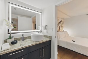 Shower, hair dryer, towels, shampoo