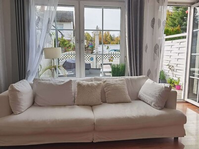 A cozy family home with a spacious garden next to a forest