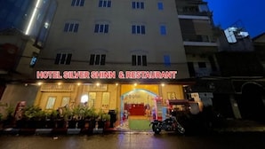 A hotel named "Hotel Silver Shinn & Restaurant" with a visible entrance and a motorcycle parked in front. - Hotel Selver Shinn & Restaurant (Phnom Penh)