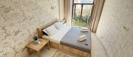 1 slaapkamer, een strijkplank/strijkijzer, wifi, beddengoed