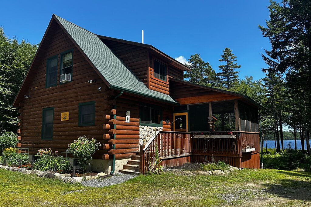 Full log cabin with mini split heat pump for heating and cooling.