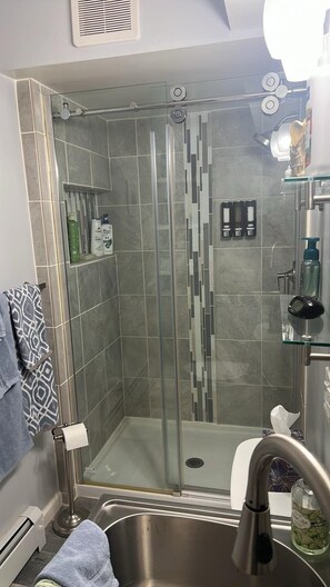 Shower, eco-friendly toiletries, hair dryer, towels