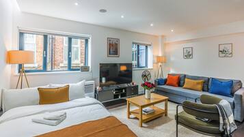 1 bedroom, desk, iron/ironing board, travel crib