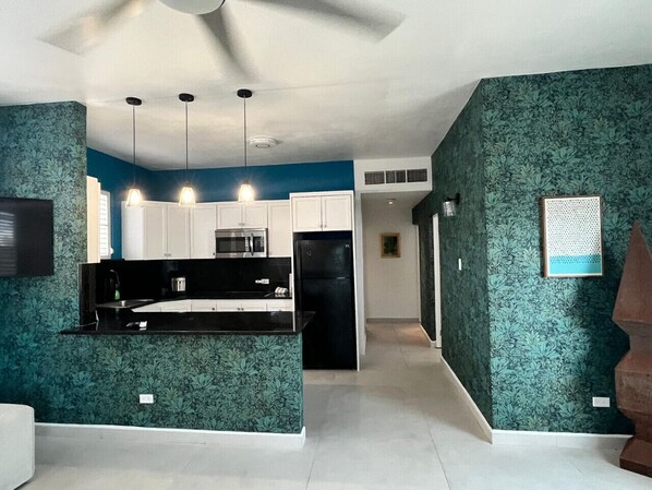 Fridge, microwave, stovetop, coffee/tea maker