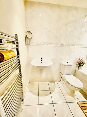 Hair dryer, towels, soap, shampoo