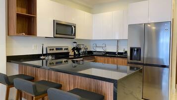 Fridge, microwave, coffee/tea maker, toaster