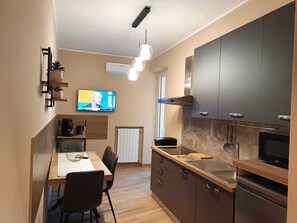 Fridge, microwave, stovetop, coffee/tea maker