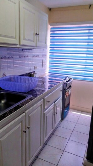 Fridge, stovetop, cookware/dishes/utensils - Adventure-Ready Beach Studio in Ocho Rios (Ocho Rios)