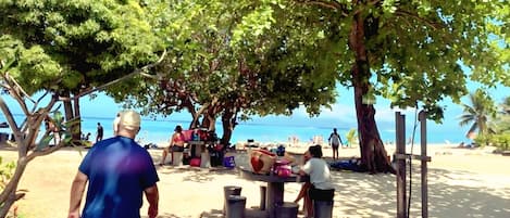 On the beach, sun-loungers