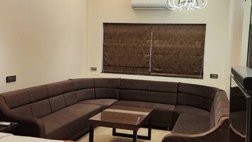 Suite, 1 Double Bed, Air conditioning, City View | 1 bedroom, in-room safe, desk, laptop workspace