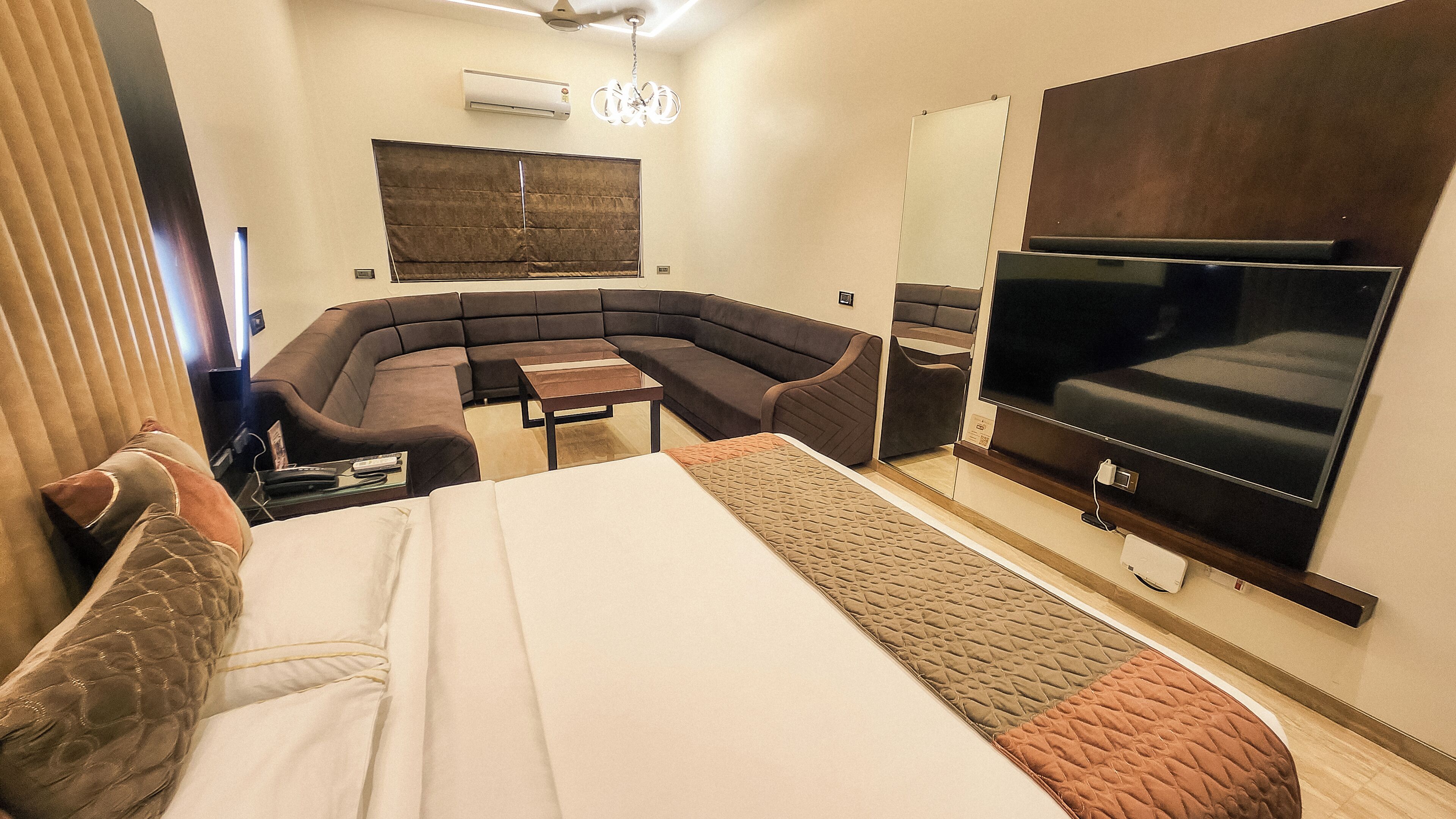 Suite, 1 Double Bed, Air conditioning, City View | In-room safe, desk, laptop workspace, iron/ironing board