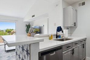 Coffee/tea maker, fridge, microwave, oven