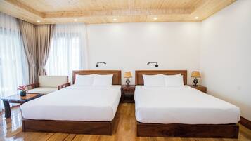 Deluxe Quadruple Room | Bathroom | Combined shower/bathtub, hair dryer, slippers, towels