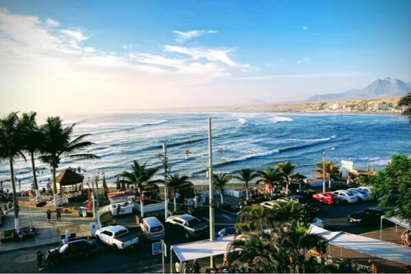 Enjoy breathtaking ocean views and serene mountain vistas from this picturesque beachside location.