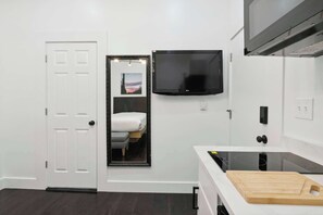 Fridge, microwave, coffee/tea maker, cookware/dishes/utensils