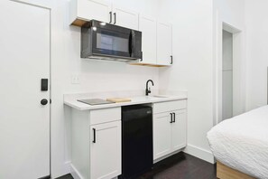 Fridge, microwave, coffee/tea maker, cookware/dishes/utensils