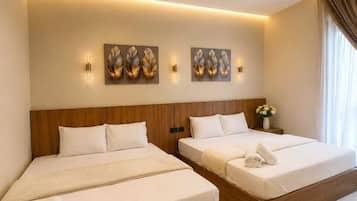 Deluxe Triple Room, Courtyard View | Living area | 32-inch LED TV with satellite channels