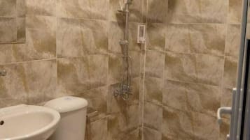 Separate bathtub and shower, slippers, bidet, soap