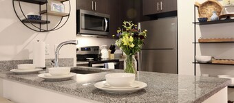 Walk to Square,Grove & Stadium Condo w/2 prking spots.Concierge svcs available!