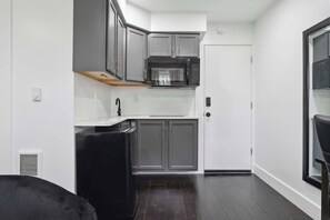 Fridge, microwave, coffee/tea maker, cookware/dishes/utensils