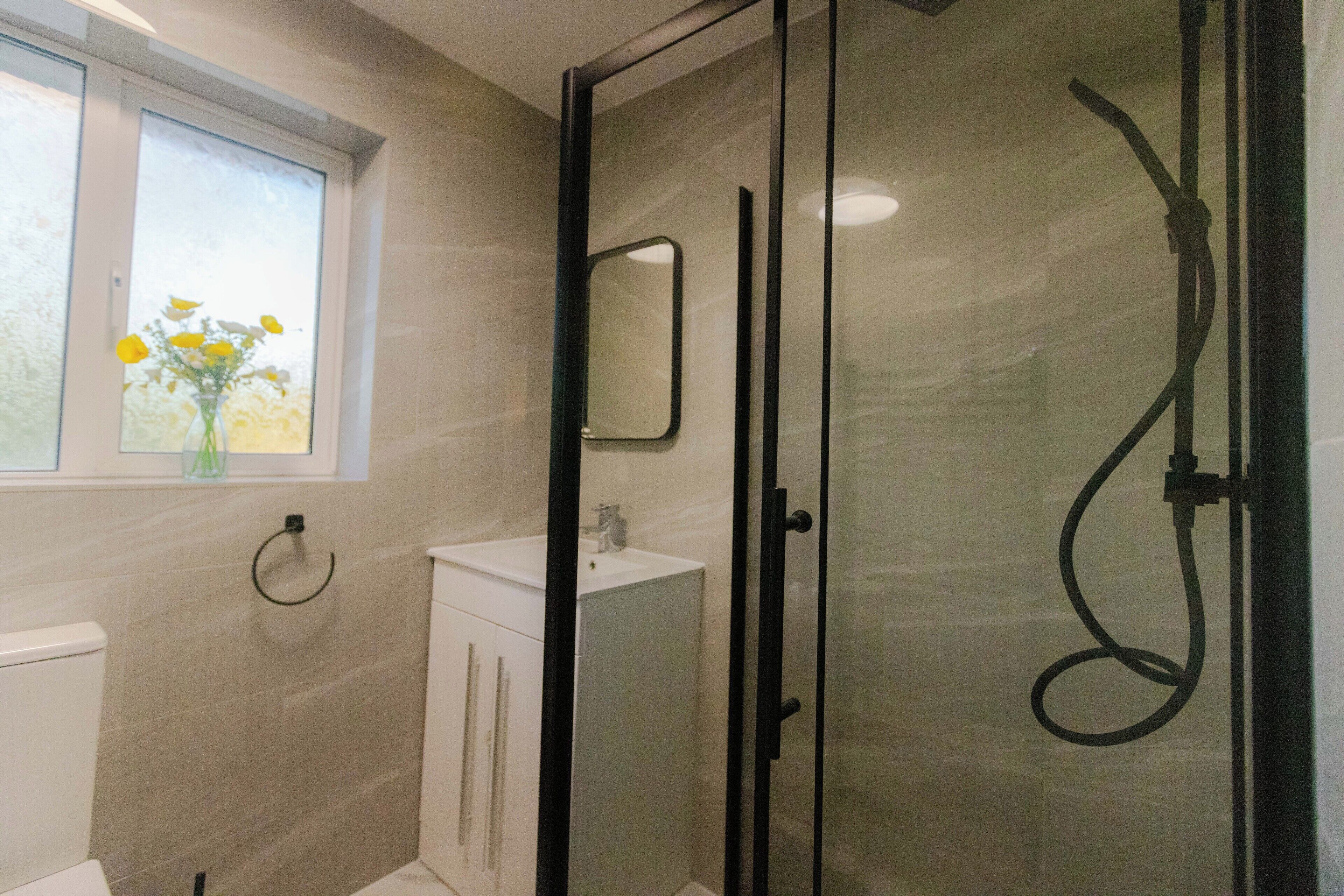 Shower, hair dryer, towels, soap