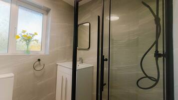 Shower, hair dryer, towels, soap