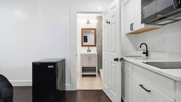 Fridge, microwave, coffee/tea maker, cookware/dishes/utensils