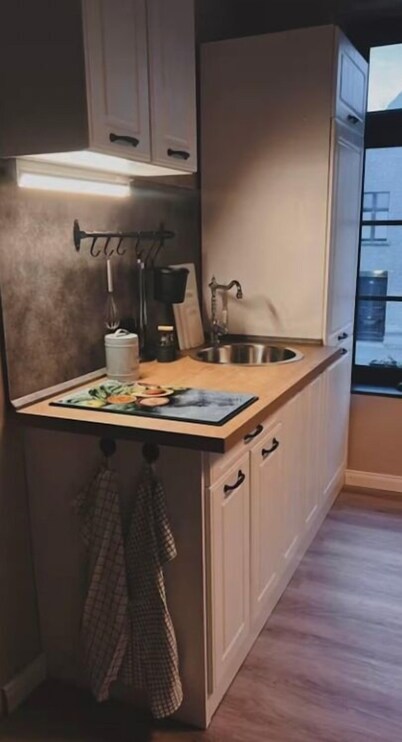 Comfortable apartment near the water with its own bar.