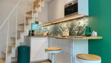 Fridge, microwave, stovetop, coffee/tea maker