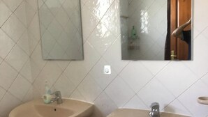 A bathroom with two sinks, a mirror, and a shower area. - Luxury Villa - Sleeps 4, Hottub Jacuzzi & Parking (Tías)