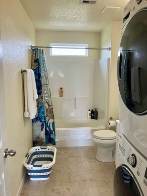 Shower, hair dryer, towels, soap
