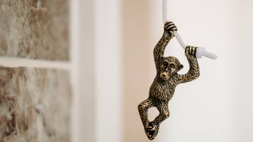 A monkey-shaped ornament hanging from a string.
