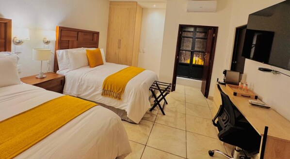 Deluxe Twin Room, City View | In-room safe, desk, laptop workspace, blackout drapes