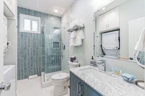 Shower, hair dryer, towels, soap