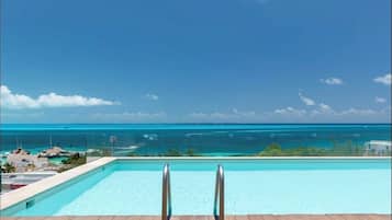 Outdoor pool, open 7:00 AM to 11:00 PM, pool loungers