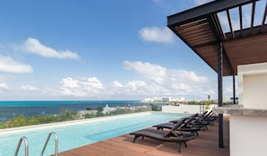 Outdoor pool, open 7:00 AM to 11:00 PM, sun loungers